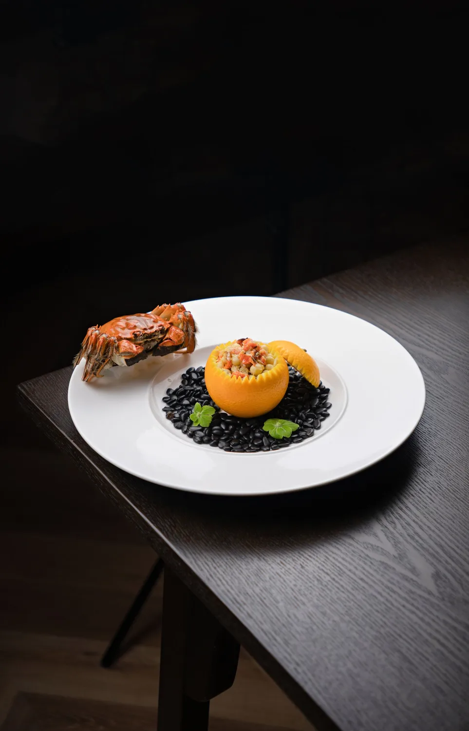 Local seafood and black beans, plated for the chef's table